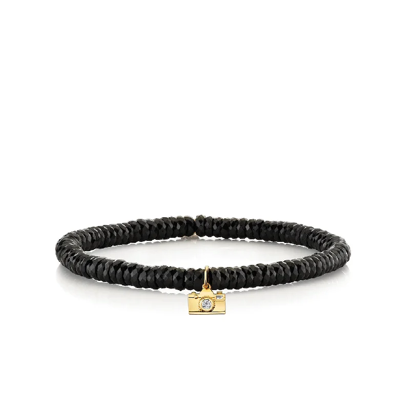 beautiful gemstone bangles -Gold & Diamond Camera On Black Spinel